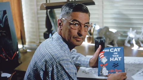 Getty Dr Seuss with his book The Cat in the Hat, pictured in 1957 (Credit: Getty)