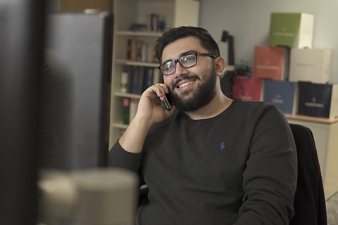 Hamzah talking on the phone.