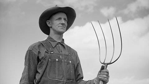 Colorado farmer, 1930s, with a pitchfork