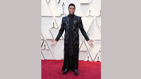 Getty Images At the 2019 Oscars, actor Chadwick Boseman wore a heavily embellished tuxedo with long train by Givenchy haute couture (Credit: Getty Images)