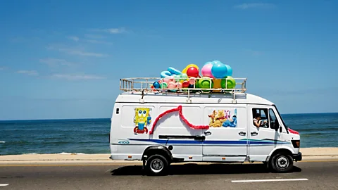 Tanya Habjouqa/NOOR Gaza City, 1 June 2013: A toy delivery van on the Gaza beach highway (Credit: Tanya Habjouqa/NOOR)