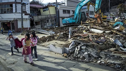 Getty Images 'Gaman' can refer to the resilience in the face of crises, like the 2011 Tohoku earthquake and tsunami - but it can also refer to smaller, everyday concerns (Credit: Getty Images)