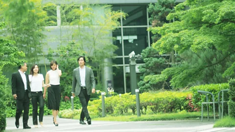 Getty Images Colleagues on a walk in Japan. A microbreak can consist of just a few minutes away from your desk (Credit: Getty Images)