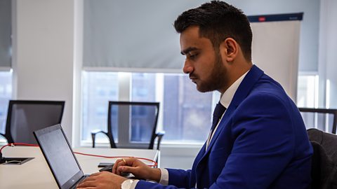 Ekansh working on a laptop