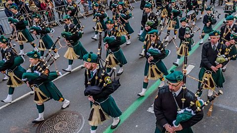 Who was first to wear green St. Patrick's Day uniforms?