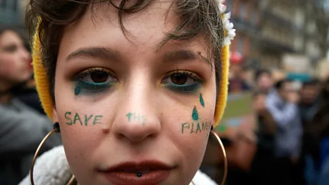 Getty Images A protestor participating in the March 2019 international strikes to campaign for more attention on mitigating climate change (Credit: Getty Images)