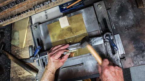 Aleksandra Koneva Michael Friedrichs-Friedländer engraves each plaque by hand (Credit: Aleksandra Koneva)