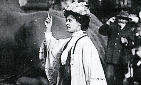 Emmeline Pankhurst talking to a crowd of people