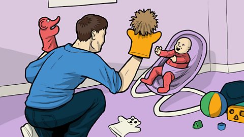 Illustration of a dad entertaining his baby with glove puppets.