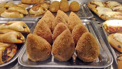 s: Stefania D’Ignoti Activists in Sicily brought arancini to welcome migrants who had been stranded at sea for days before being permitted to disembark on the island (Credits: Stefania D’Ignoti)