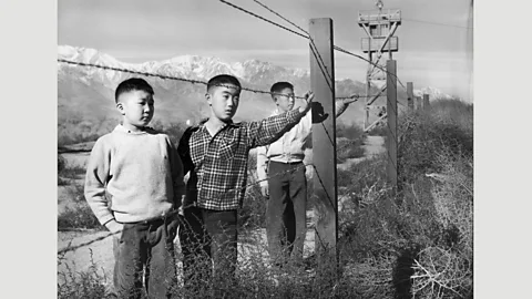 Toyo Miyatake Studio Tōyō Miyatake, Three Boys Behind Barbed Wire, 1944 (Credit: Toyo Miyatake Studio)