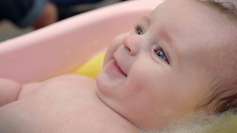 A baby in the bath.