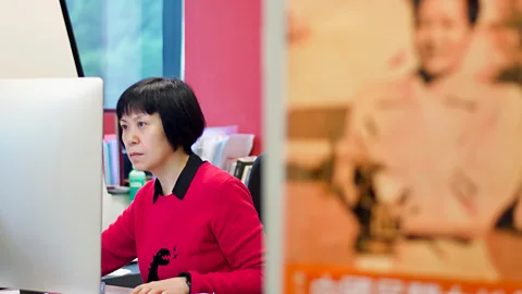 Harriet Constable Filmmaker Louisa Wei edits her new movie – in the foreground is a poster of Esther Eng (Credit: Harriet Constable)