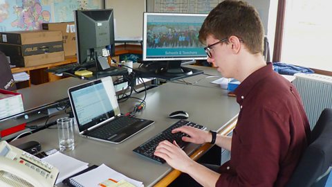 Callum working on the computer.