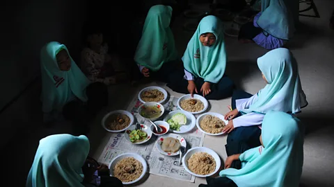 Getty The sharing of food is common in many world religions - and it may reflect some prehistoric preoccupations (Credit: Getty)