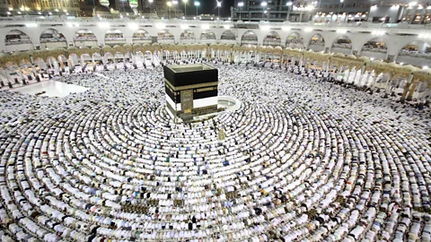 Getty Muslim worshippers perform the evening (Isha) prayers at the Kaaba. Emotions such as awe, loyalty, and love are central to many religious celebrations (Credit: Getty)