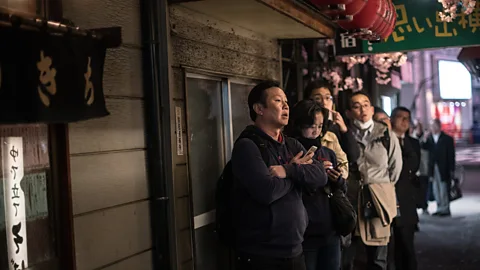 Getty Images Customers in Tokyo queueing for a popular restaurant. Unpleasant, unavoidable situations like these warrant a "shou ga nai" (Credit: Getty Images)
