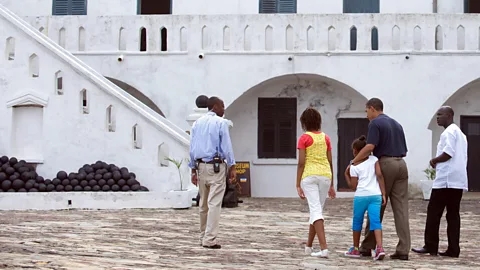 Saul Loeb/Getty Images Former US President Barack Obama and his daughters took a guided tour of Cape Coast Castle in Ghana (Credit: Saul Loeb/Getty Images)