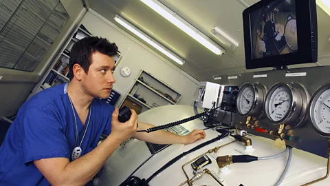 Getty Divers who spend long periods in deep water need to decompress for several days in a hyperbaric chamber (Credit: Getty)