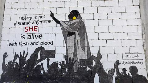 Getty Within a week of the photograph going viral, images of Alaa Salah sprung up on billboards and in murals (Credit: Getty)