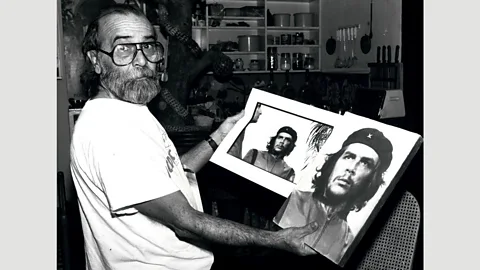 Alamy Alberto Korda is pictured with the uncropped and cropped versions of his photograph of Che Guevera (Credit: Alamy)