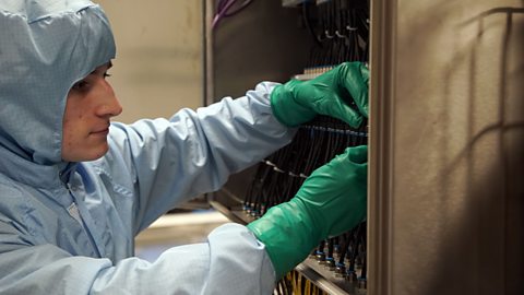 Ben working on electrical equipment.