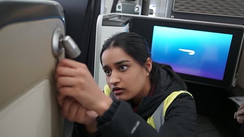 Balwant repairing a fault inside the aircraft.