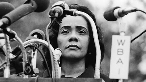 Coretta Scott King standing behind a podium at Peace-In-Vietnam Rally, Central Park, New York, April 27, 1968.