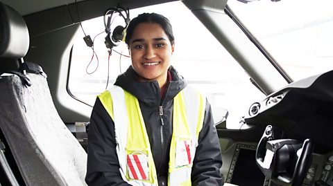 Balwant sat in the cabin of an airplane.