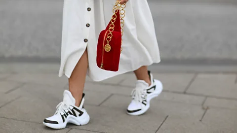 Getty Images Chunky trainers such as these by Louis Vuitton have largely taken over from heels in fashion circles (Credit: Getty Images)
