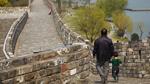 National Geographic Image Collection/Alamy Nanjing’s 600-year-old wall contours to the city’s lake and mountain areas (Credit: National Geographic Image Collection/Alamy)