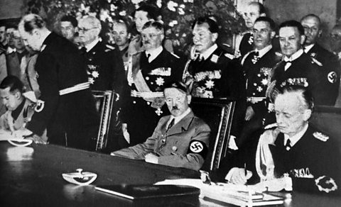 Photograph of Galeazzo Ciano, Adolf Hitler and Joachim Von Ribbentrop at the signing of the Pact of Steel in the Reichskanzlei in Berlin 22 May 1939