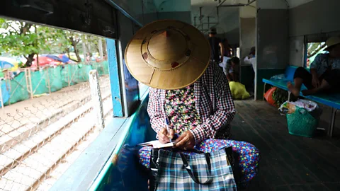 Peter Yeung A woman rides the Circular Railway in Yangon, Myanmar