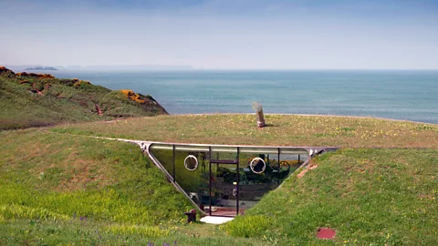 Architecture UK/Alamy Inside the hill, an ellipse-shaped glass frontage opens to the sea (Credit: Architecture UK/Alamy)