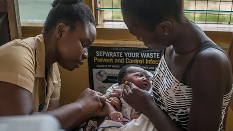 Getty Images A nurse administers a vaccine to a child at Ewin Polyclinic in Cape Coast, Ghana (Credit: Getty Images)