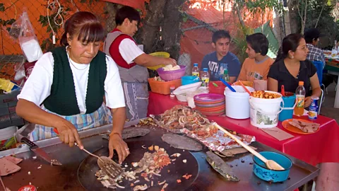 David R. Frazier Photolibrary, Inc./Alamy A women prepares made-to-order quesadillas and other street food in Mexico City (Credit: David R. Frazier Photolibrary, Inc./Alamy)