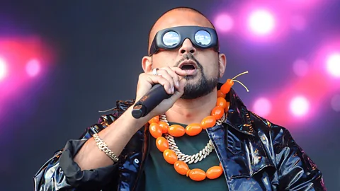 Dave J Hogan/Getty Images Sean Paul winning the unofficial “Best Sunglasses of the Festival” award (Credit: Dave J Hogan/Getty Images)