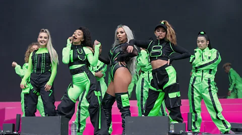 Jo Hale/Redferns Little Mix channeling Janet Jackson by way of Tron for their set (Credit: Jo Hale/Redferns)