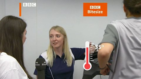 A student runs on a treadmill as Dr Stebbings talks. A graphic of a thermometer indicates that the temperature is 35 degrees Celsius. 