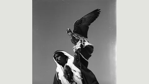 Norma Jabbur collection, courtesy of the Arab Image Foundation A bedouin carrying the falcon he uses to hunt, Syrian Desert, by Jibrail Jabbur (Credit: Norma Jabbur collection, courtesy of the Arab Image Foundation)