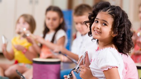 Children playing instruments together