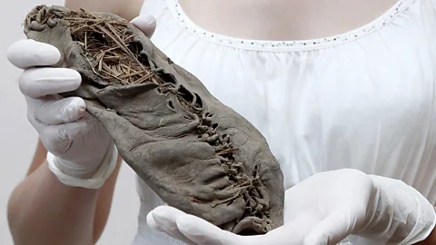 Getty Images A 5,500-year moccasin said to be the world's oldest leather shoe (Credit: Getty Images)