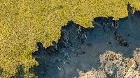 Alamy The melting permafrost is creating huge sinkholes (Credit: Alamy)