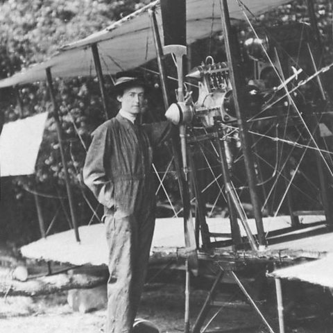 Photograph of Lilian Bland standing in front of her aeroplane the 'Mayfly'