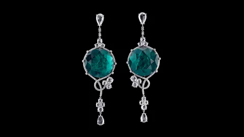 2018 Carnet Jewelry The Cleopatra long-drop earrings by Carnet recall Art Deco style and are made with emeralds and white diamonds in platinum and white gold (Credit: 2018 Carnet Jewelry)
