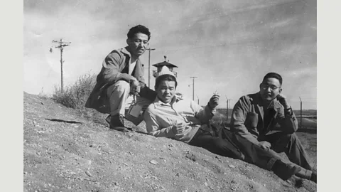 the Gay, Lesbian, Bisexual, Transgender Historical Society Three gay men by guard tower, Tule Lake concentration (relocation) camp, California, early 1940s (Courtesy of the Gay, Lesbian, Bisexual, Transgender Historical Society)