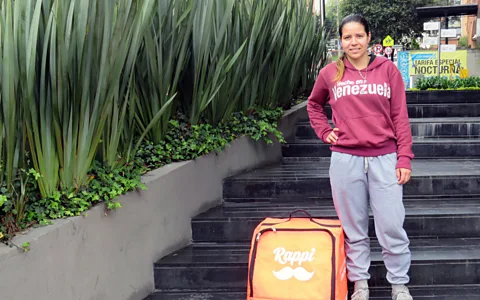 Luiza Bandiera Jusmely Vasquez, 24, is one of many Venezuelan bike couriers for Columbia-based Rappi. Some experts believe that the migrant crisis has fuelled growth of the "super-app"