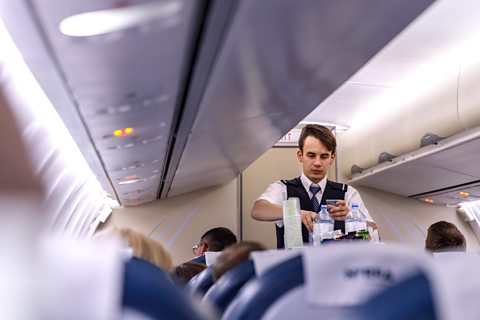 Cabin crew serving passengers
