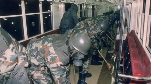 Getty Images A tiny drop of sarin can kill so those cleaning up after incidents like the 1995 attack in Tokyo need to wear extensive protective clothing (Credit: Getty Images)