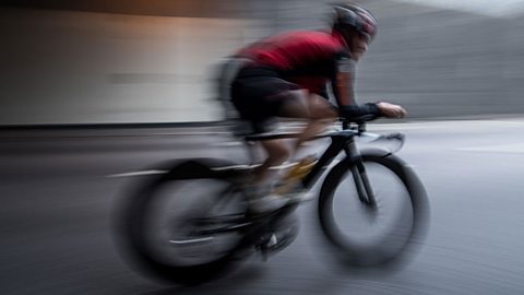 Blurry image of a cyclist on a bike